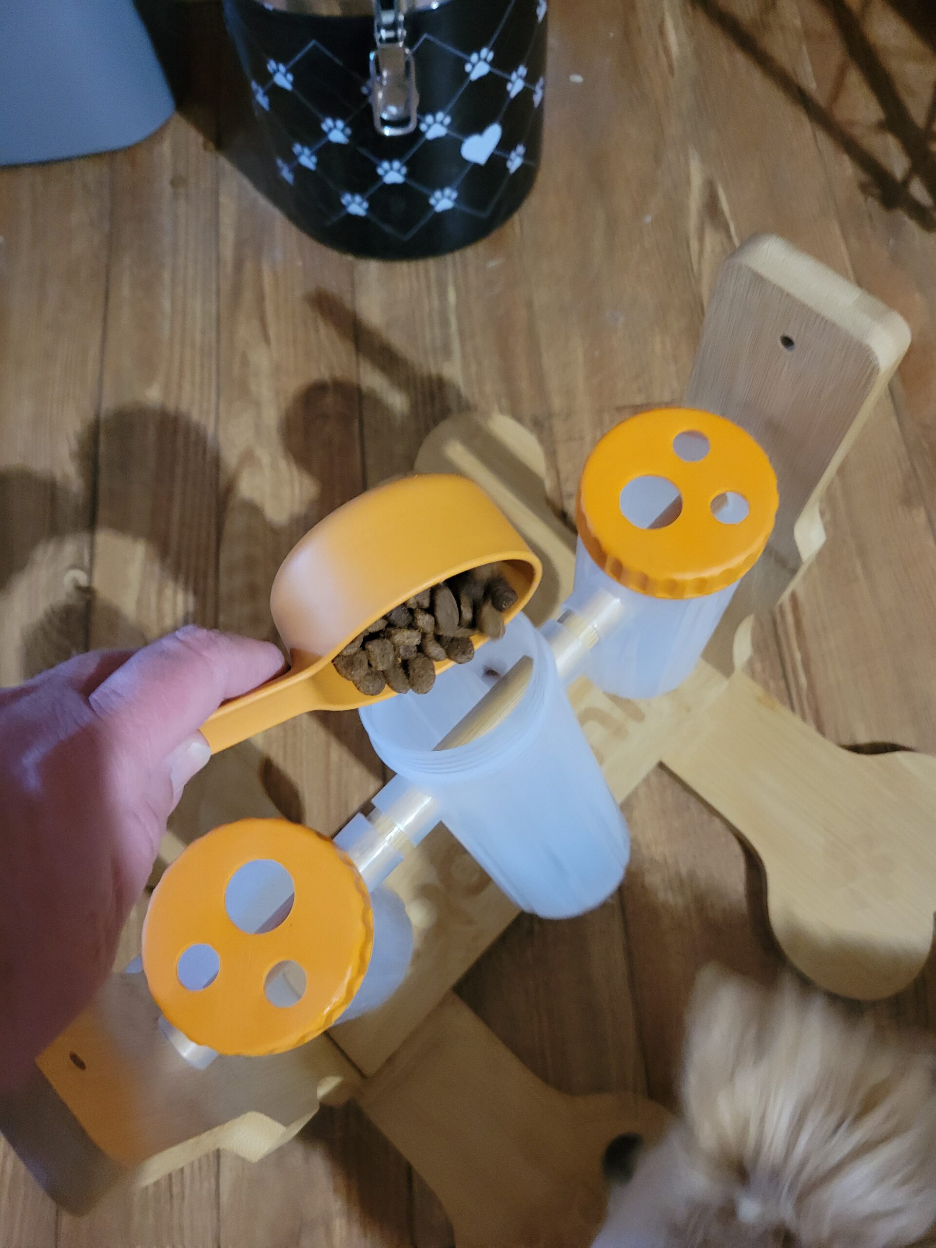 dog puzzle feeder for small dogs close up showing rotating tube mechanism with kibble