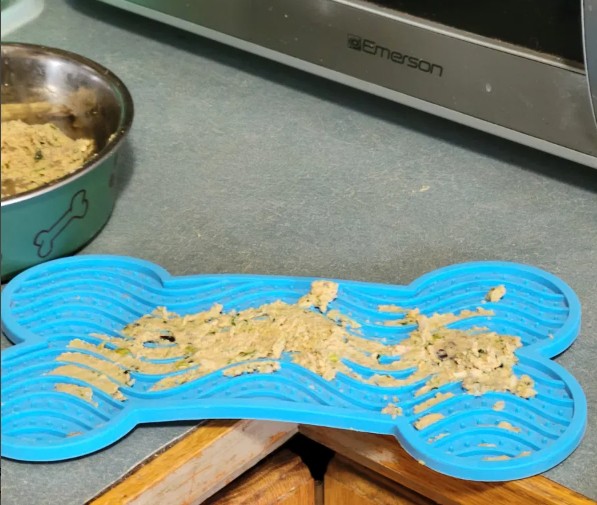 silicone lick mat loaded with Olivia Alice's food
